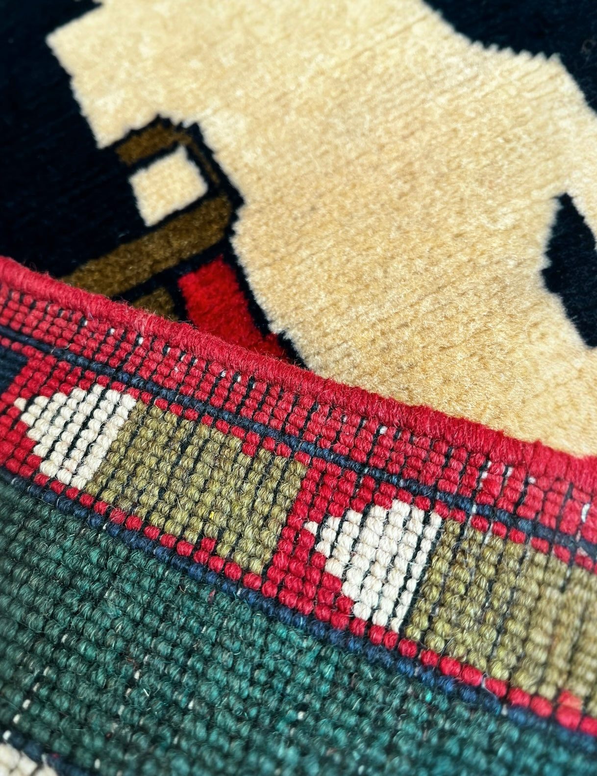 131cm x 80cm Black, Cream & Red War Rug