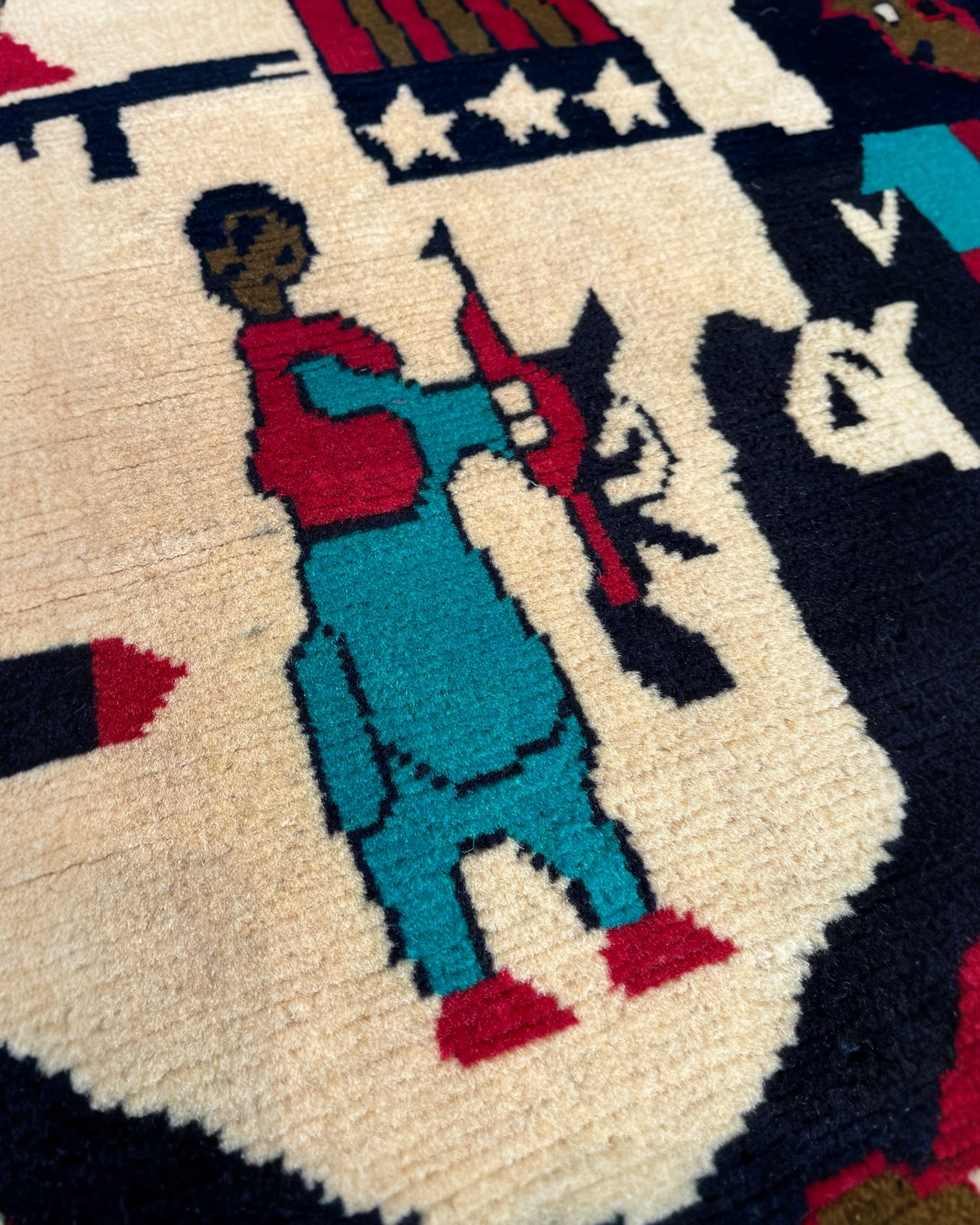 131cm x 80cm Black, Cream & Red War Rug